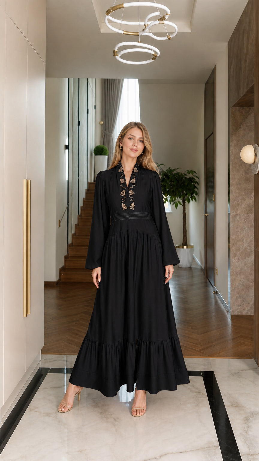Black embroidered long sleeve tiered maxi dress on model