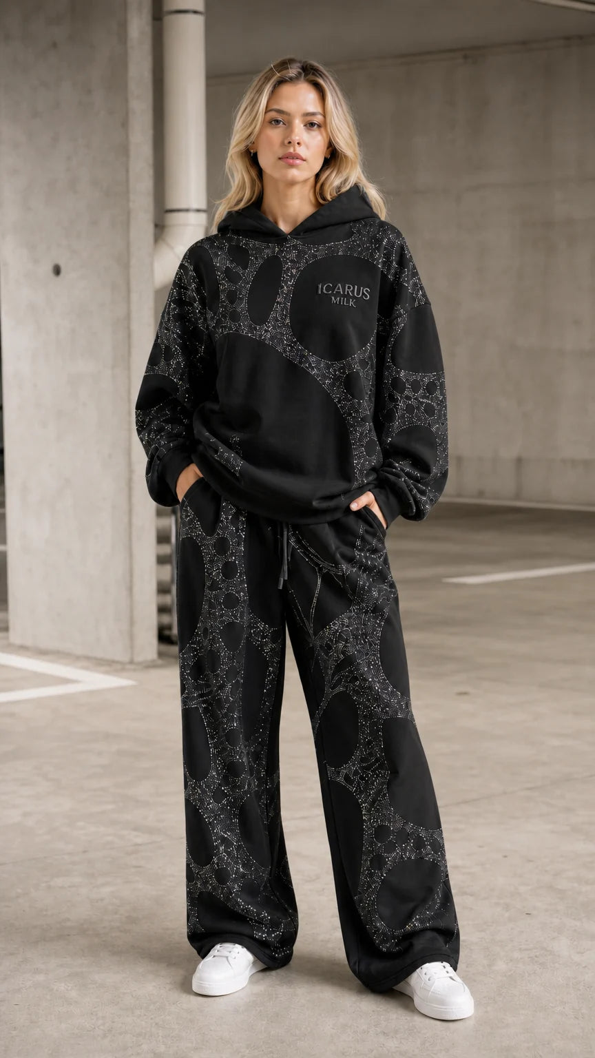 Front view of model wearing black rhinestone hoodie and pants set