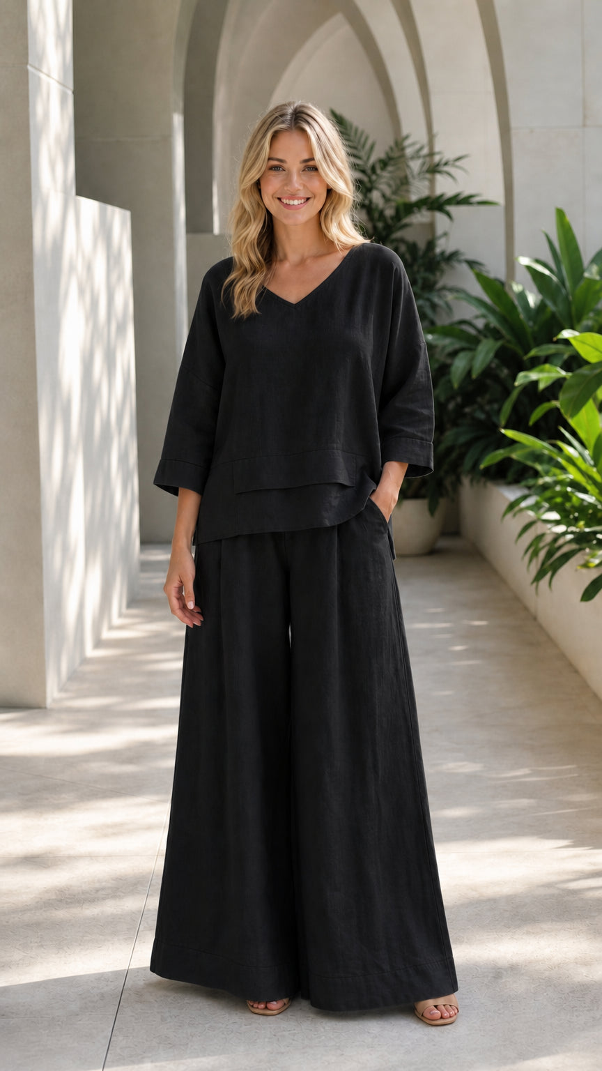 Woman wearing black two-piece wide-leg lounge set