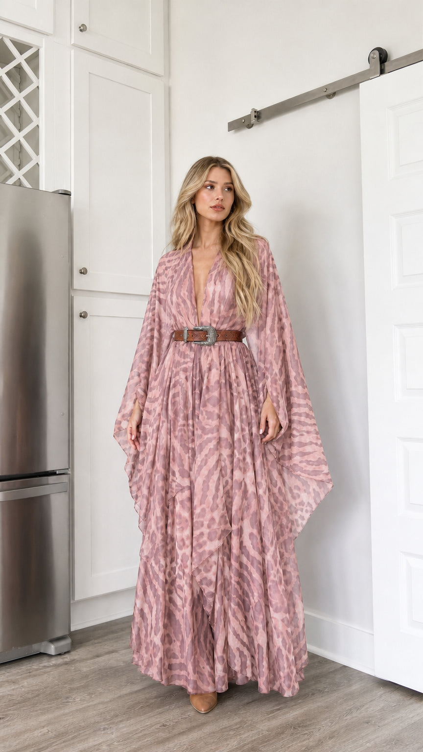 Woman wearing dusty pink animal print flowy plunge maxi dress