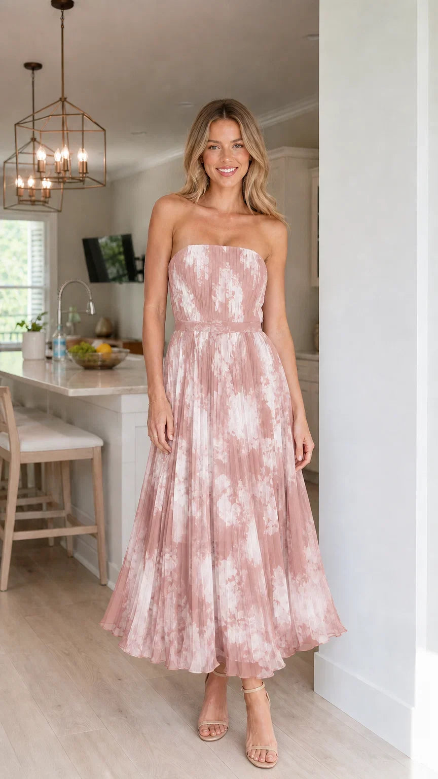 Woman wearing pink strapless pleated floral midi dress