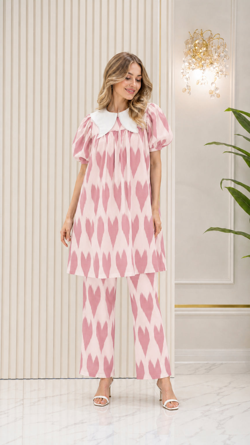Model wearing Blush Pink geometric pattern tunic top and trouser set