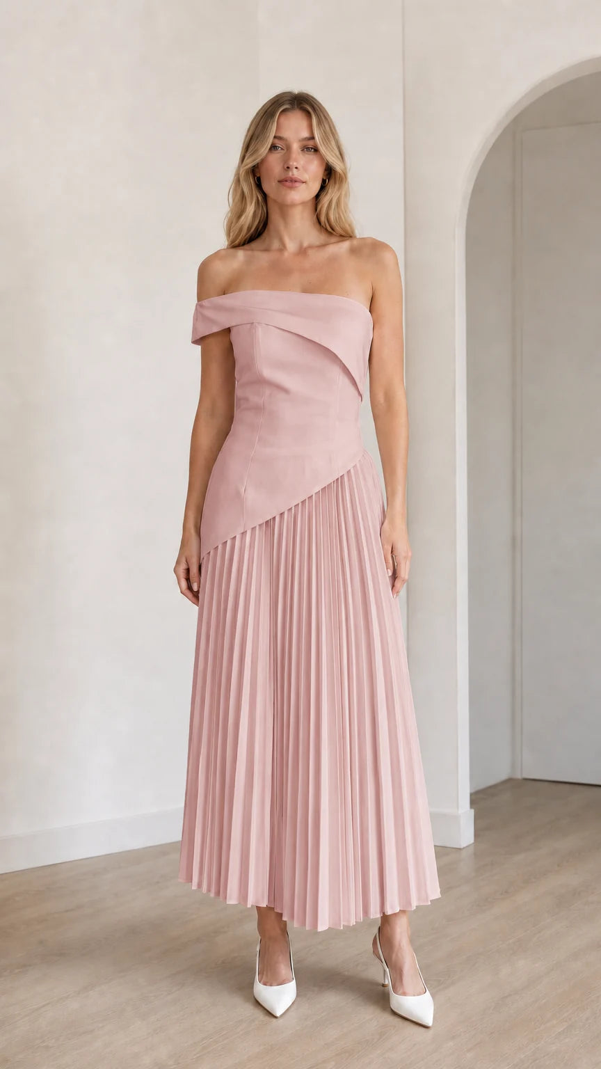 Model wearing pink off-shoulder asymmetric pleated midi dress