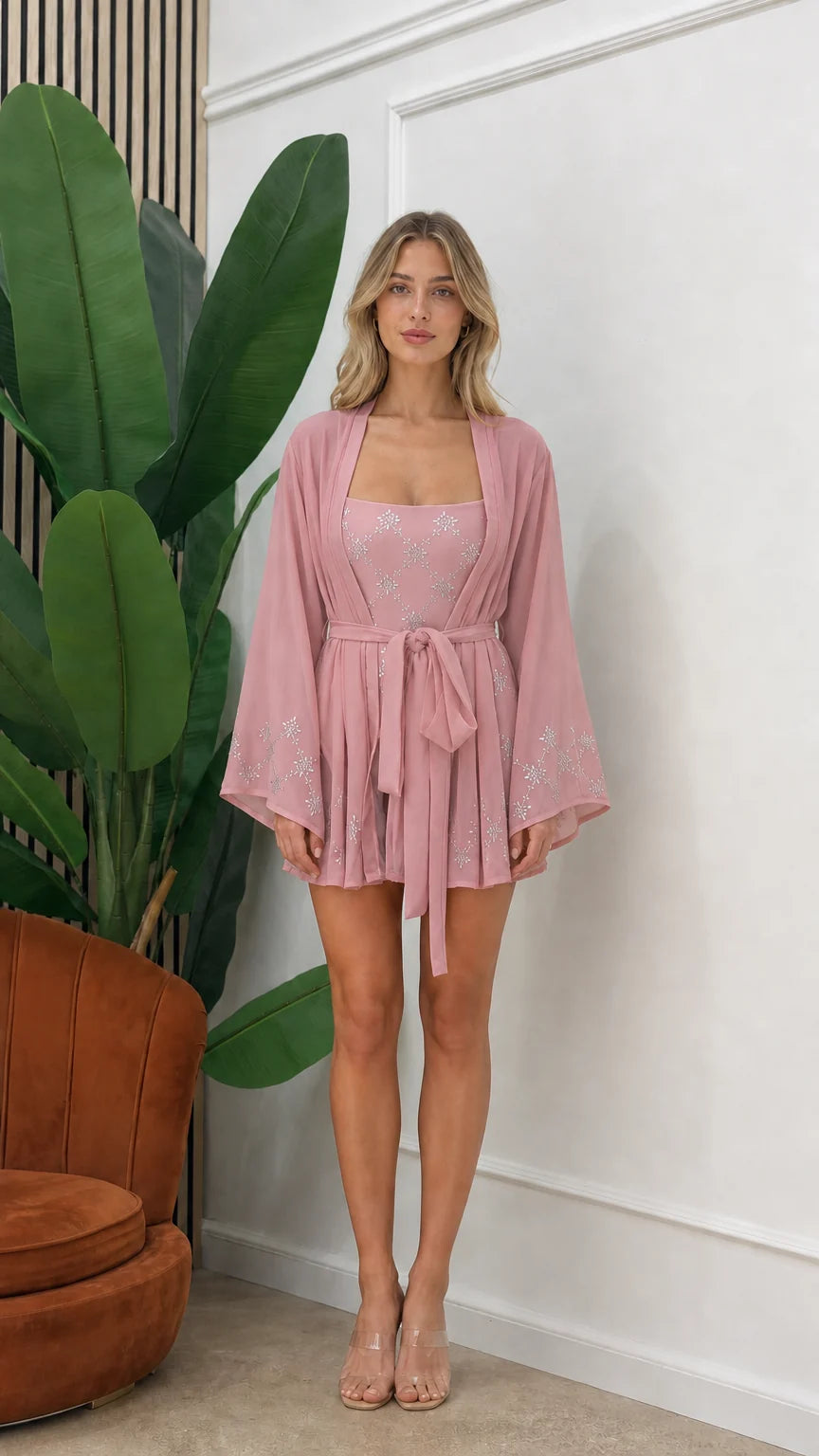 Front view of model wearing pink embellished three-piece kimono set