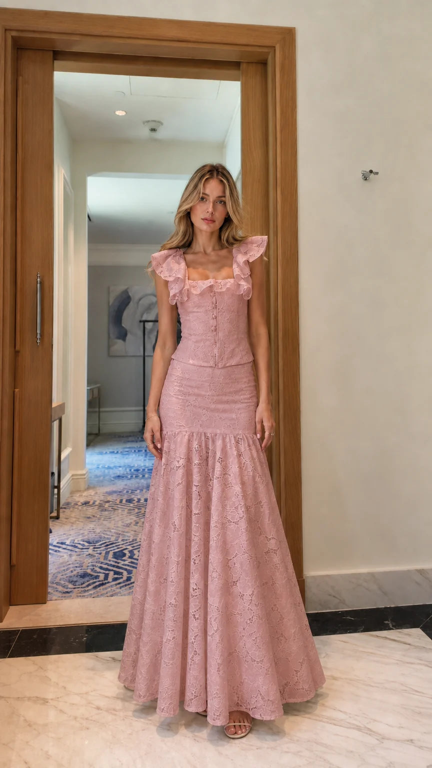 Model wearing pink lace crop top and mermaid maxi skirt set