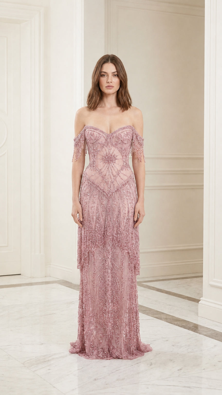 Model wearing dusty rose beaded evening gown, front view