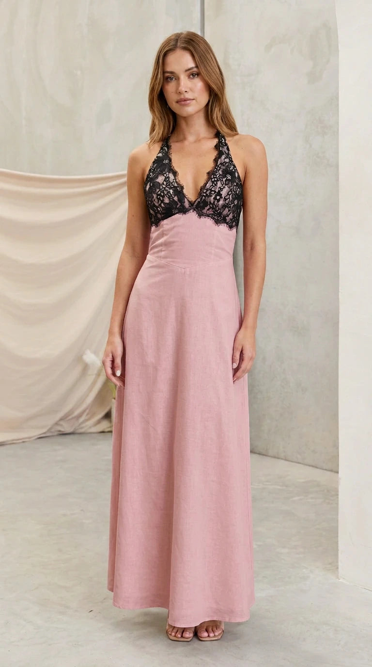 Model wearing dusty pink halter maxi dress with black lace bust