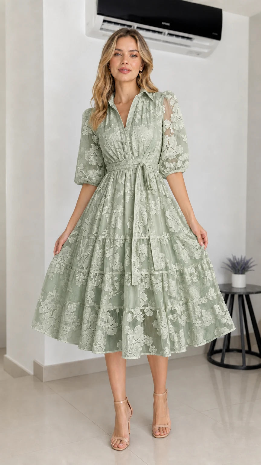 Front view of sage green floral embroidered midi dress