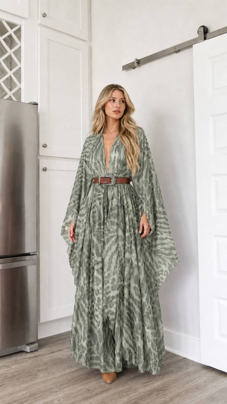 Woman wearing sage green draped kimono sleeve maxi dress