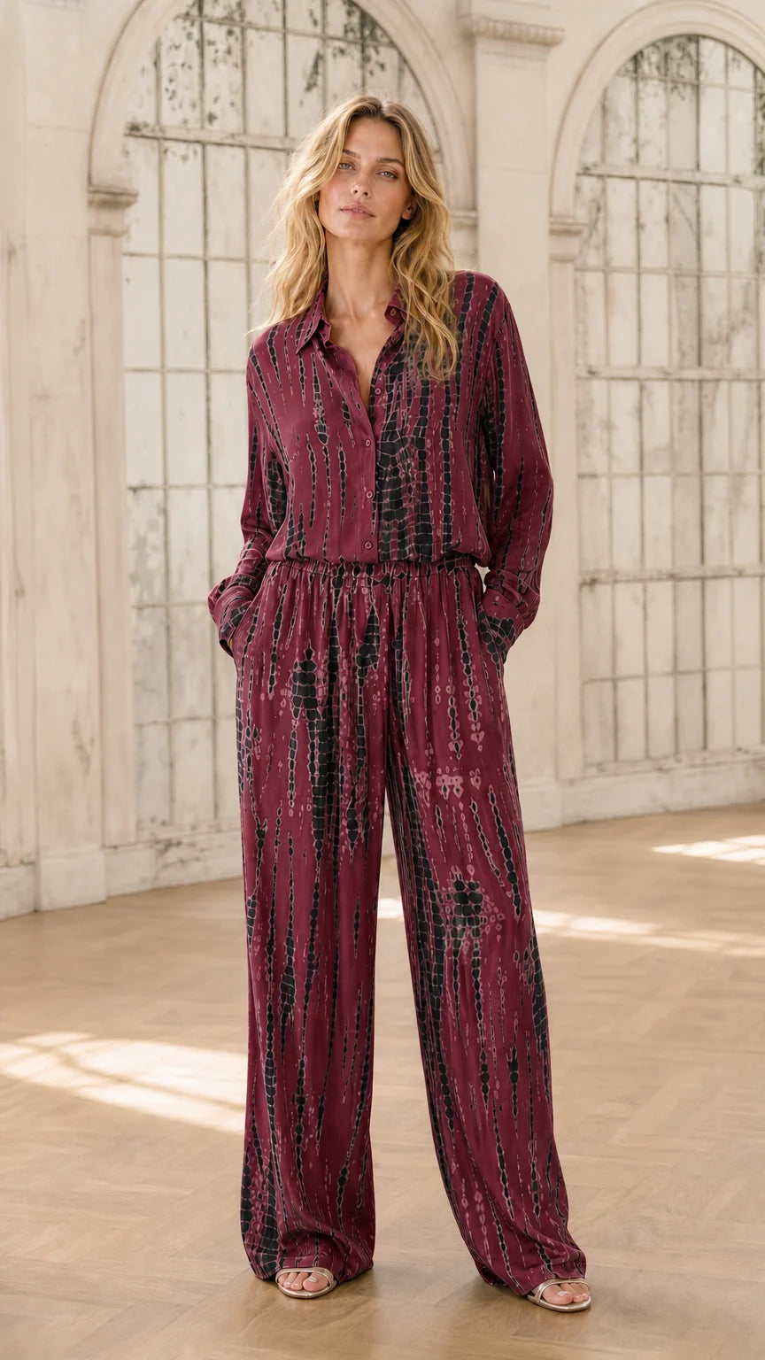 Model wearing burgundy tie-dye jumpsuit