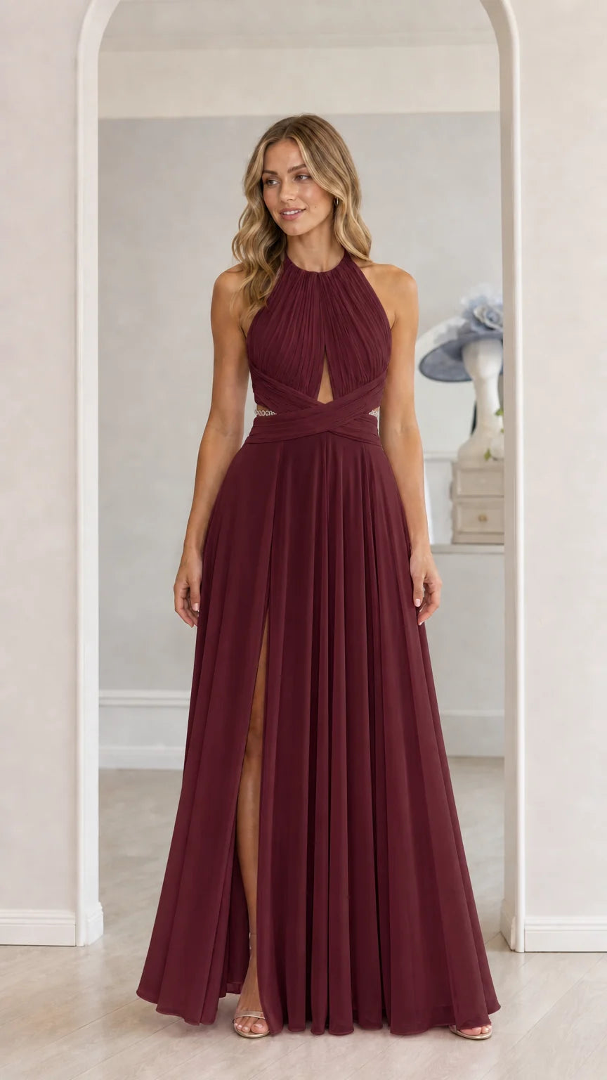Model wearing burgundy chiffon halter maxi dress with front slit