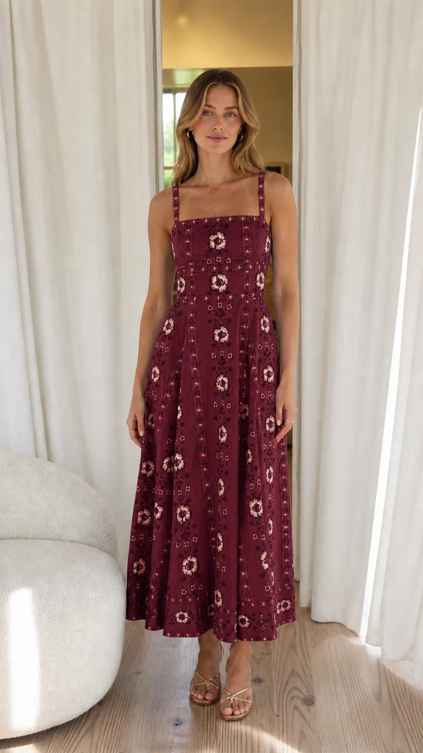 Woman wearing burgundy floral embroidered midi dress