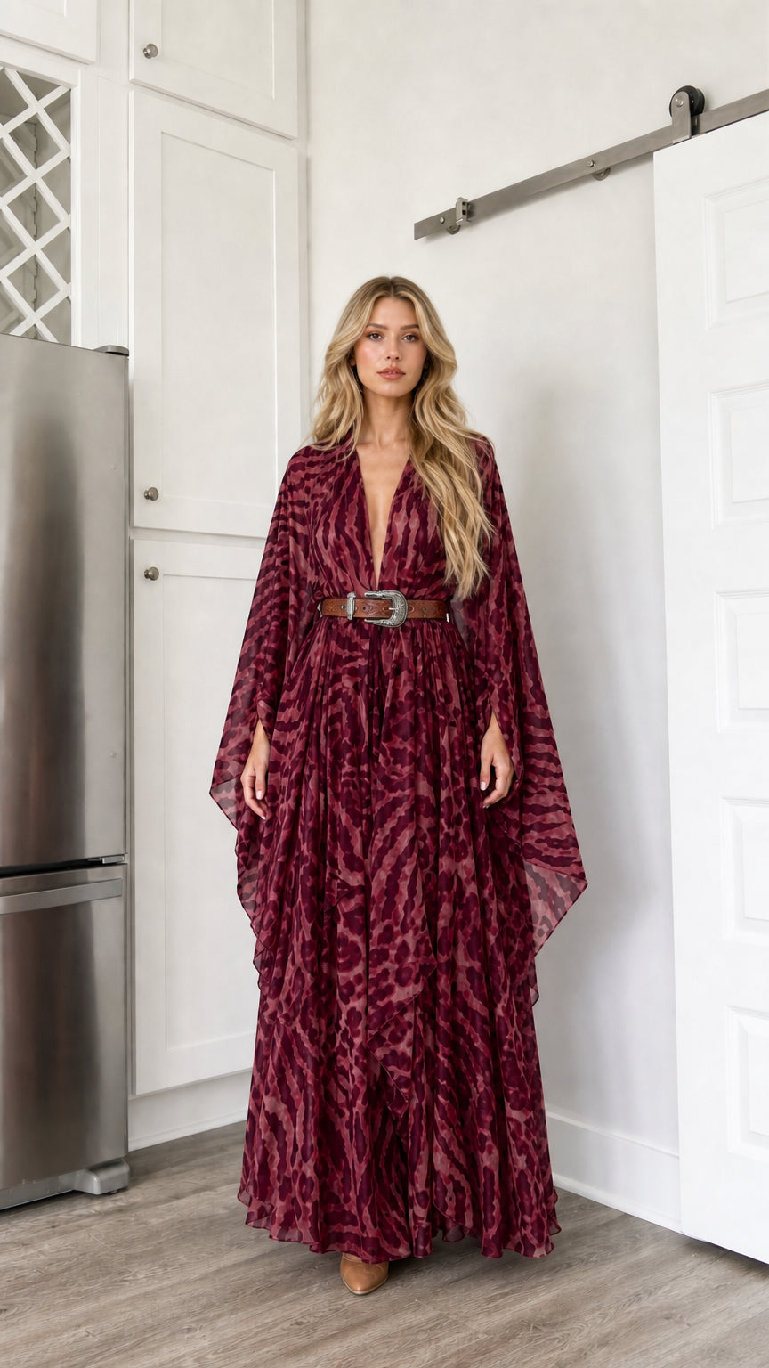 Woman wearing burgundy wine colored animal print kimono maxi dress