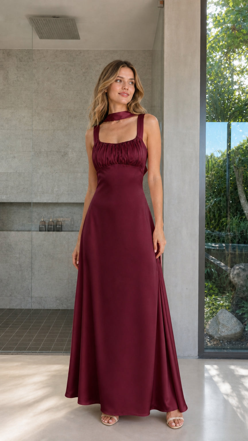 Model wearing Burgundy satin ruched bust maxi dress front view