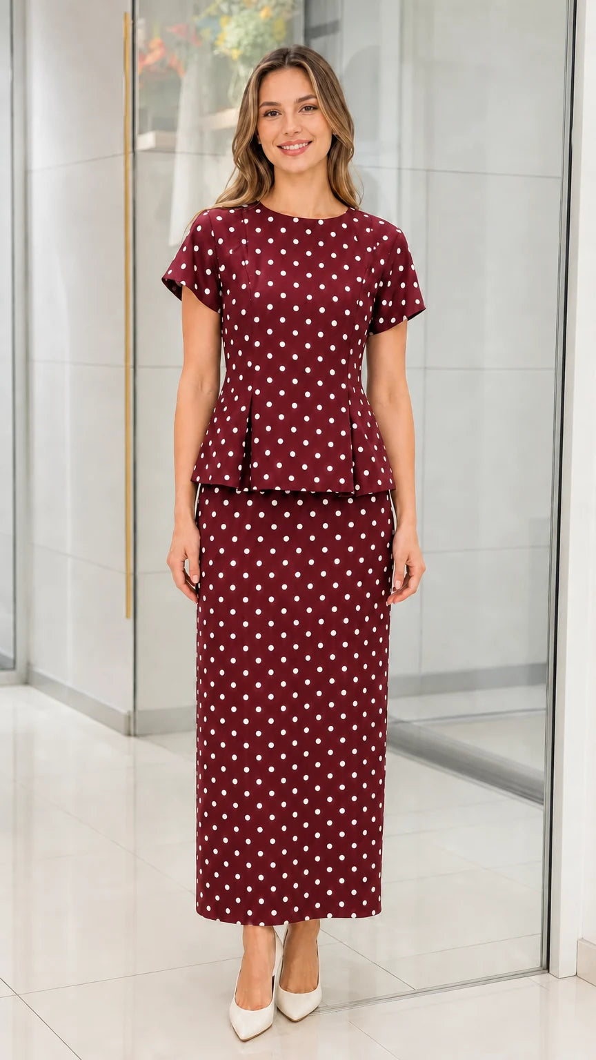 Front view of burgundy polka dot two piece set on model