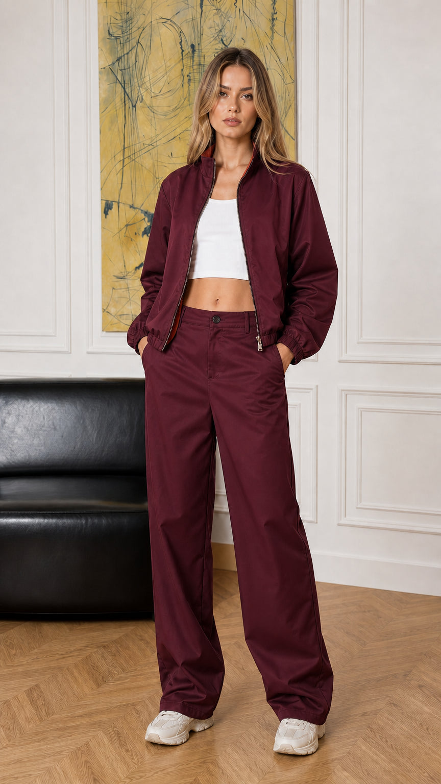 Full-length view of woman modeling the burgundy two-piece jacket and pants set