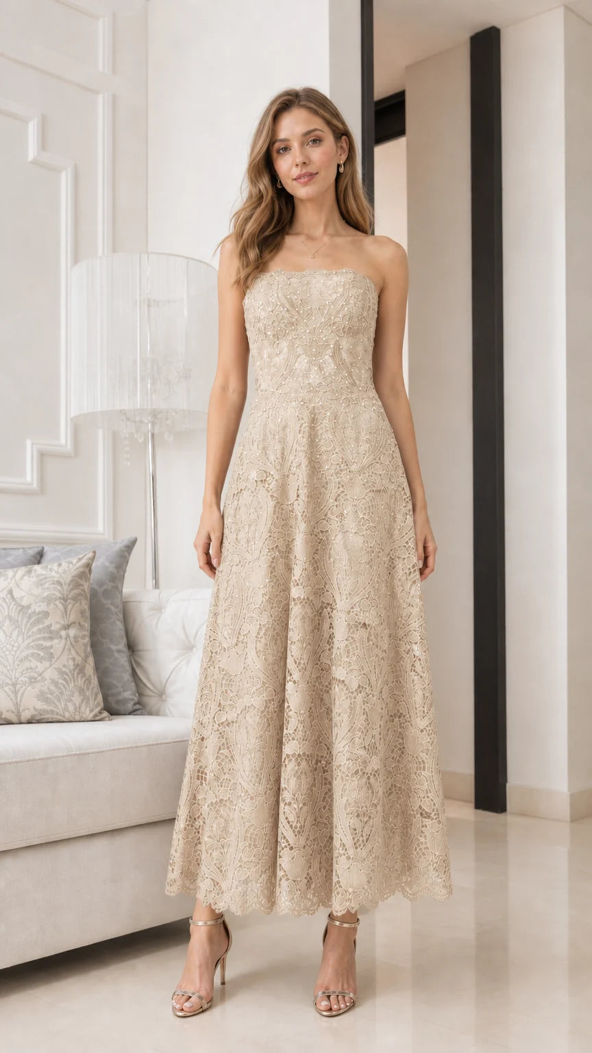 Front view of model wearing champagne strapless lace midi dress