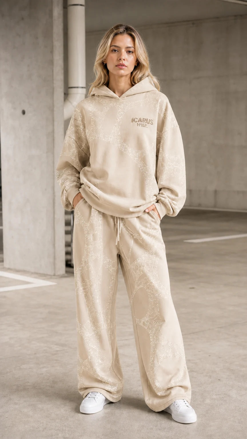 Front view of model wearing beige rhinestone hoodie and pants set
